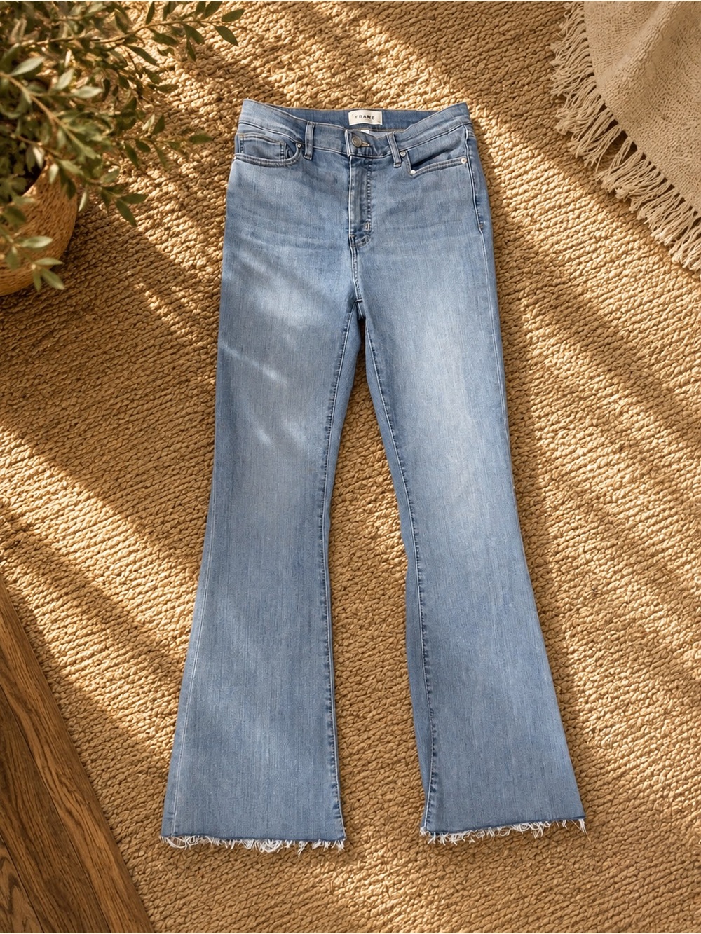 Frame Denim Light Blue Flare Jeans with Raw Hem